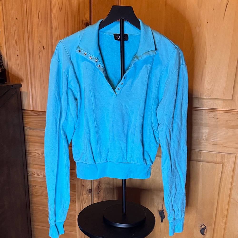 NUX Black Label on Turquoise Fabric